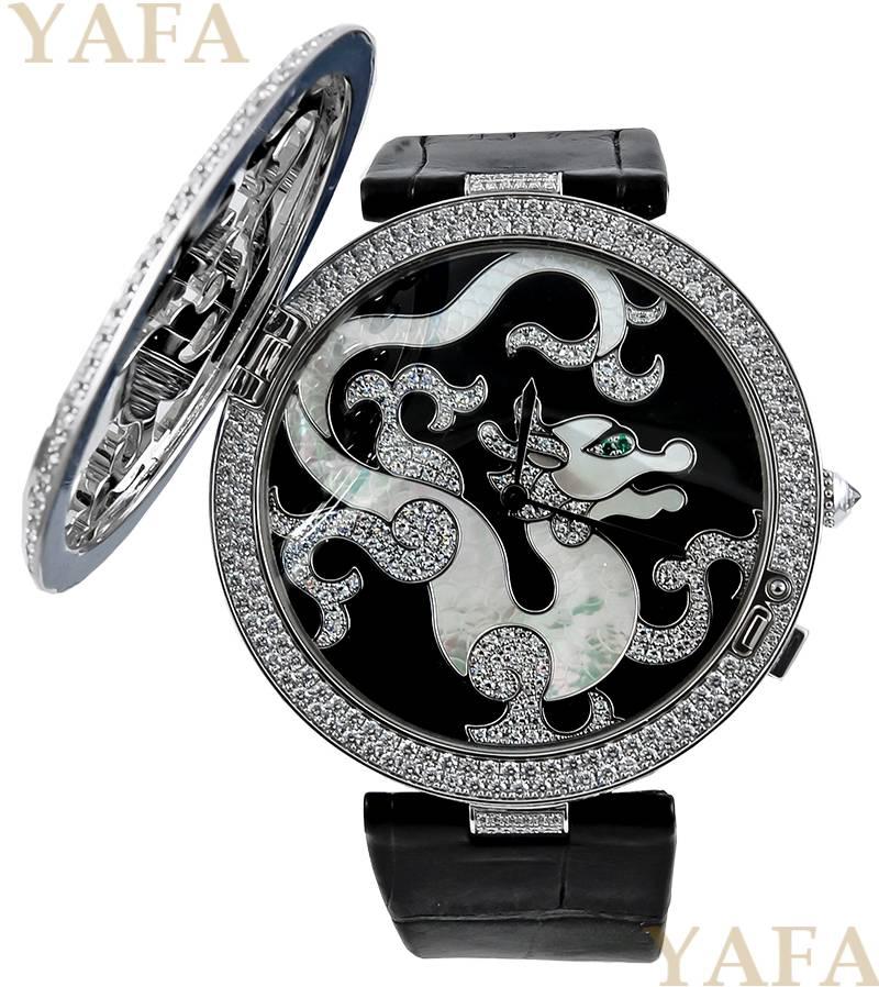 A rare Cartier white gold Pasha de Cartier 42mm Skeleton Dragon Motif watch, with interweaving diamond bands forming a dragon and a marquise-cut tsavorite eye. The black alligator strap has a white gold folding buckle, set with brilliant-cut