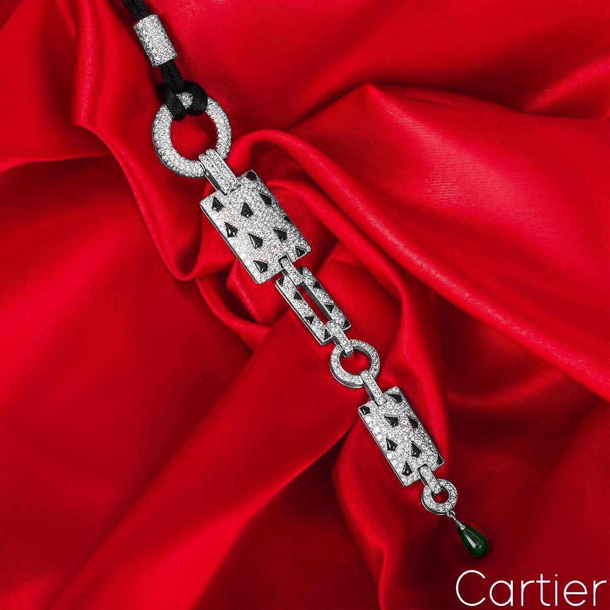 A remarkable 18k white gold Cartier necklace from the Panthere collection. The necklace is formed of circular and rectangular motifs featuring 26 scattered black onyx markings and pave set diamonds. The necklace has a total of 416 round brilliant