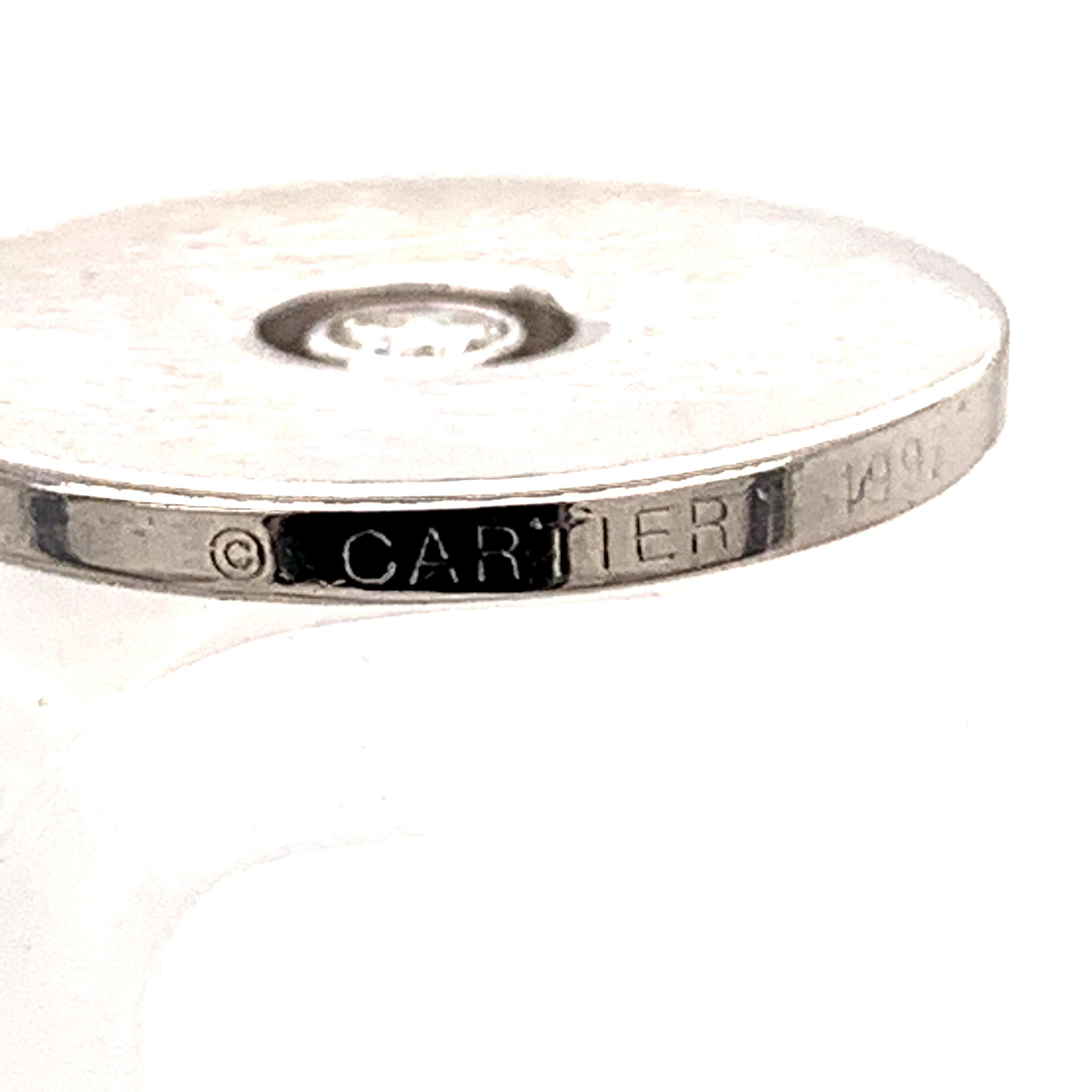 Sleek, modern pendant/charm.  Made, signed and numbered by CARTIER.  18K white gold, with a bezel-set center diamond.  2/3