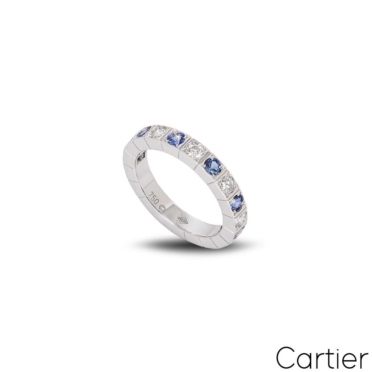 A timeless 18k white gold diamond and sapphire ring by Cartier from the Lanieres collection. The ring is claw set with 12 alternating round brilliant cut diamonds and sapphires, complemented by the iconic Lanieres design around the back and outer