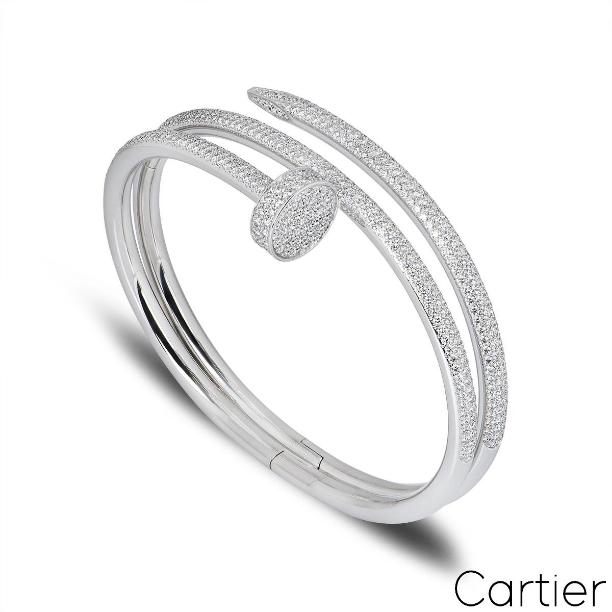 A stunning 18k white gold diamond bracelet by Cartier from the Juste Un Clou collection. The bracelet is of a nail design, fully pave set around the outer side with 624 round brilliant cut diamonds totalling 3.61ct. The bracelet measures 2cm at the