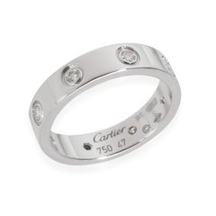 Bague Love en or blanc à diamants et petit modèle de Cartier