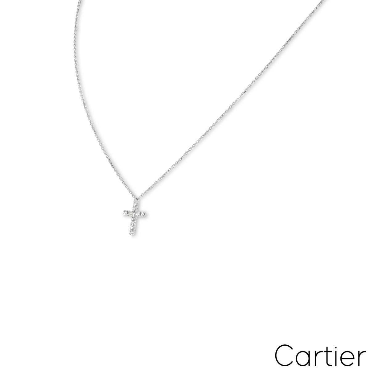 A lovely 18k white gold diamond pendant by Cartier from the Symbols collection. The pendant features a cross motif pave set with 11 round brilliant cut diamonds with an approximate total weight of 0.13ct, predominately F colour and VS clarity. The