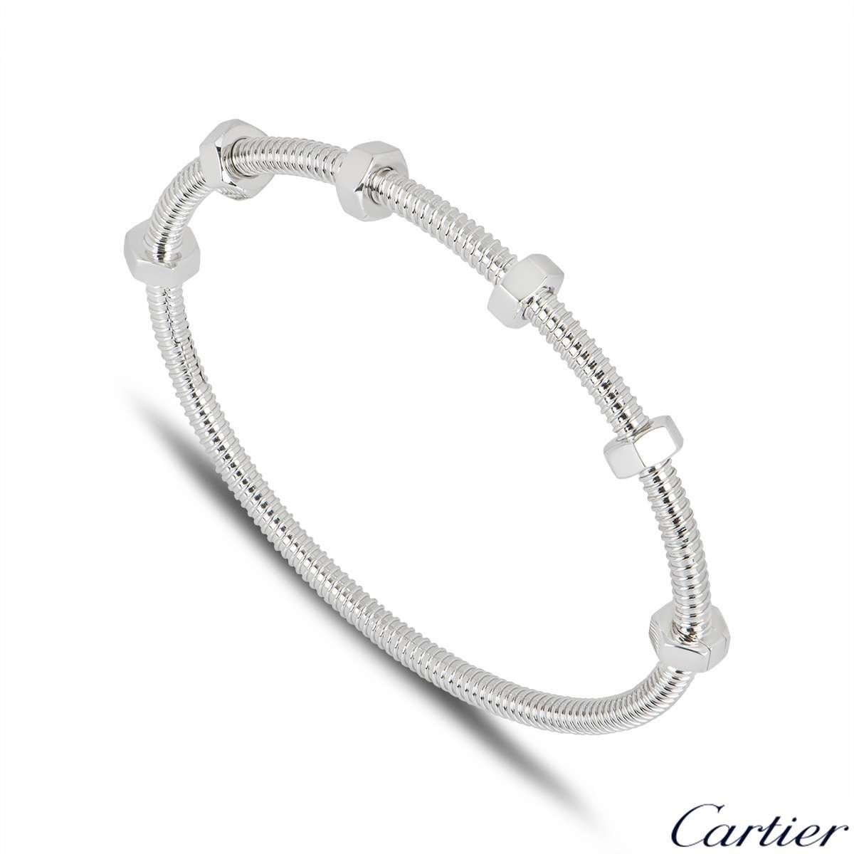 A stunning 18k white gold bracelet by Cartier from the Ecrou De Cartier collection. The bracelet has a threaded design which features 6 bolts with 4 swivelling freely along one side of the bracelet. The bracelet is a size 16 and has a gross weight