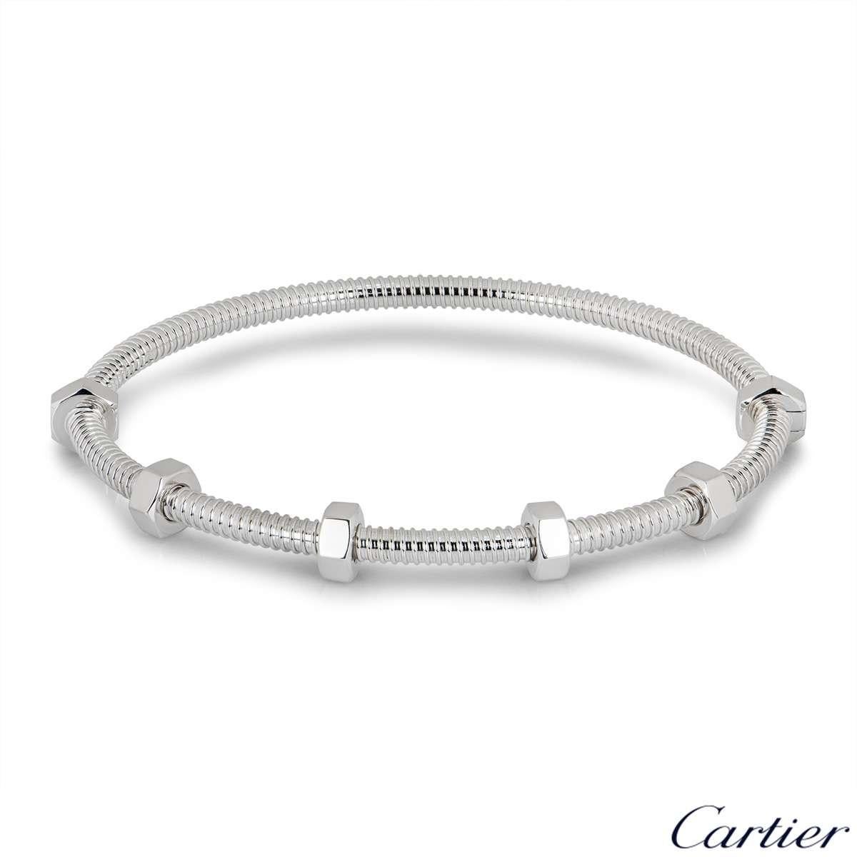 A stunning 18k white gold bracelet by Cartier from the Ecrou De Cartier collection. The bracelet has a threaded design which features 6 bolts with 4 swivelling freely along one side of the bracelet. The bracelet is a size 16 and has a gross weight