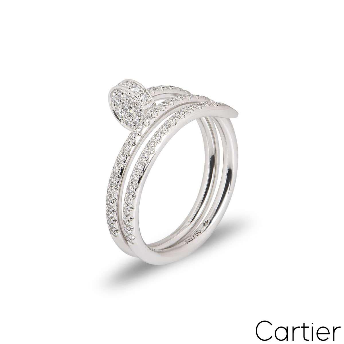 An 18k white gold double Juste Un Clou ring by Cartier. The ring is in the style of a nail wrapping around the finger, set with round brilliant cut diamonds to the front sections. There are 77 diamonds with a total diamond weight of 0.59ct. The ring