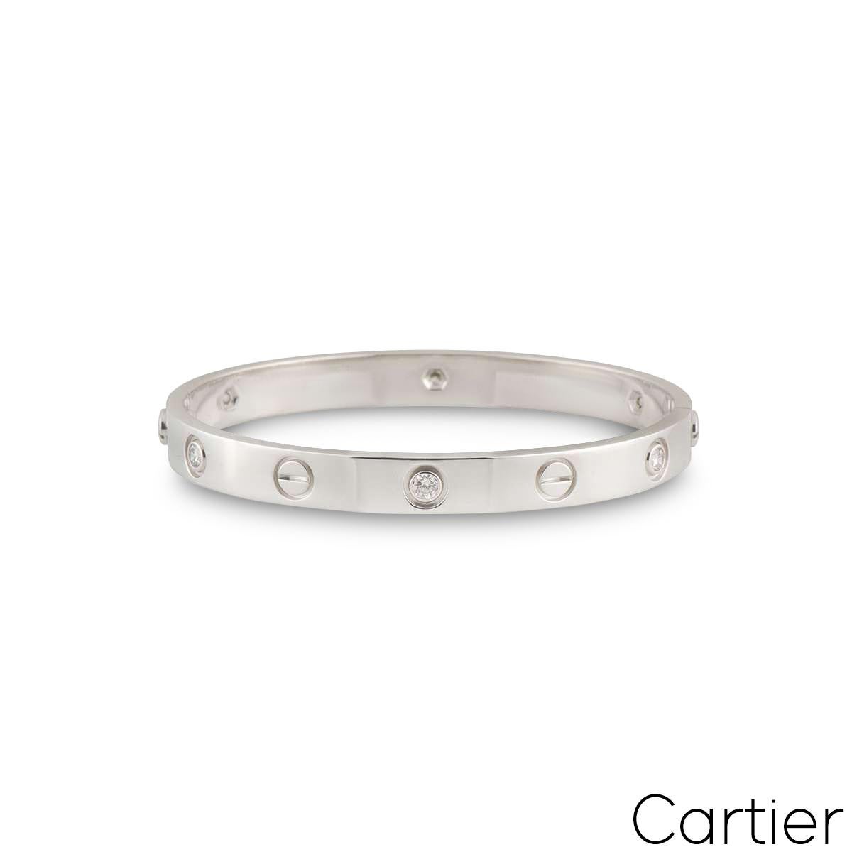 An iconic 18k white gold Cartier diamond bracelet from the Love collection. The bracelet comprises of the iconic screw motifs alternating with round brilliant cut diamonds. There are 6 round brilliant cut diamond in a rubover setting with an