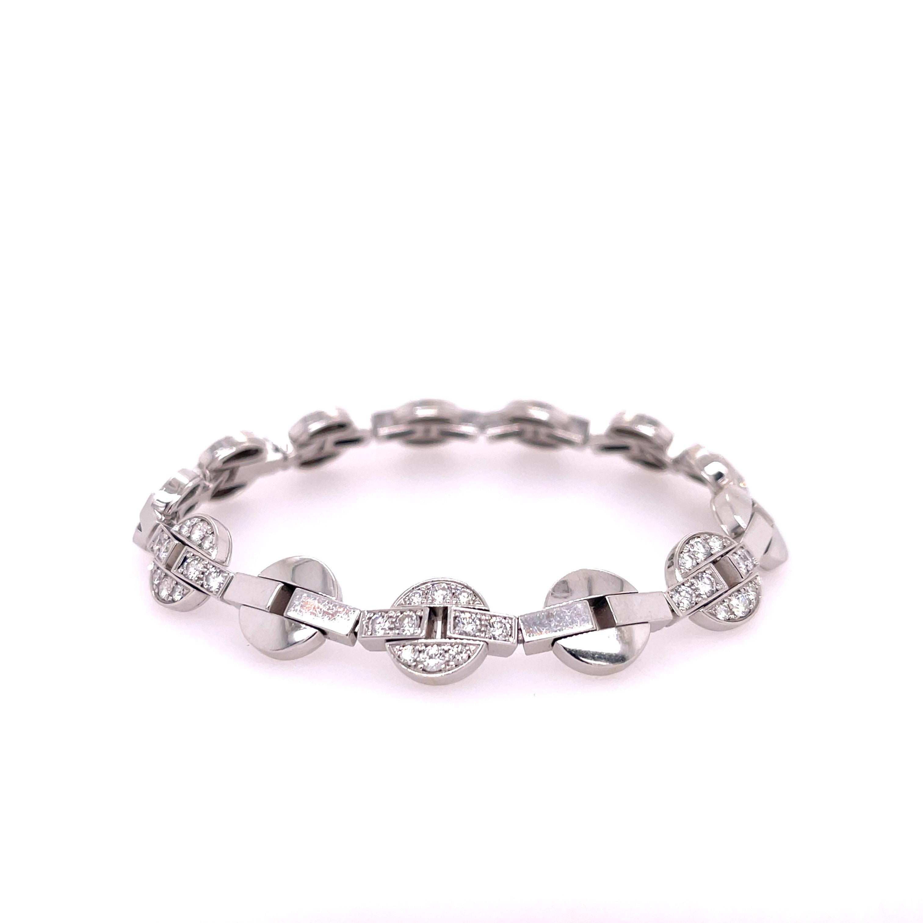 18K White Gold Diamond Bracelet Pre-Owned from Cartier Himalia Collection. 
This bracelet is in excellent condition. 50 VS clarity diamonds set in circular design.