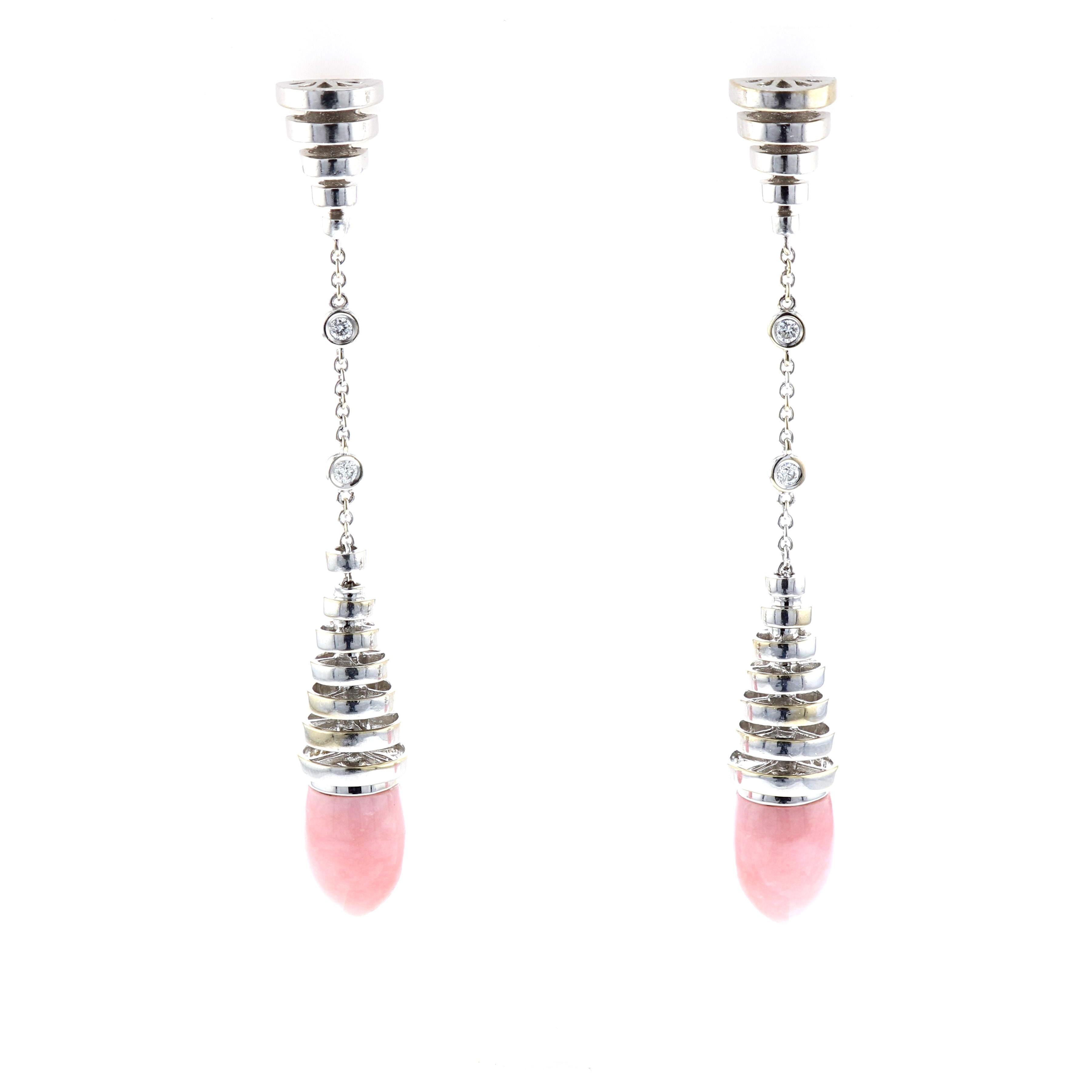 Cartier drop earrings in 18K white gold with diamonds and interchangeable onyx and rose quartz drops.  The four round diamonds total 0.20 carats; F-G color and VVS-VS clarity.  Earrings measure 3 1/4 inches long and 3/8 inches at the widest point. 