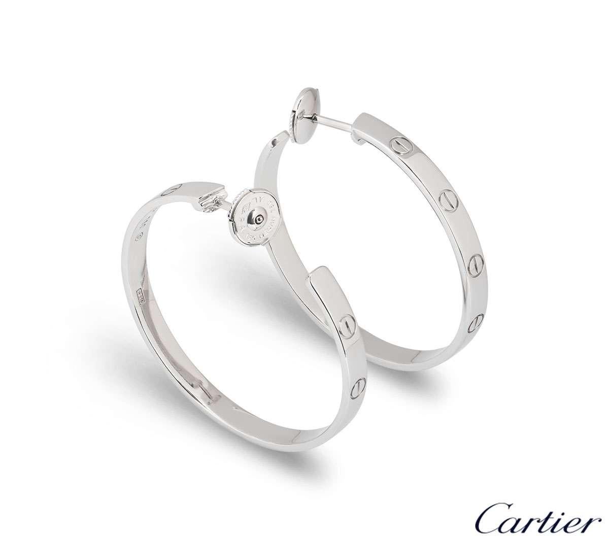 A stylish pair of 18k white gold Cartier hoop earrings from the Love collection. Each earring comprises of the iconic screw motif around the outer edge. The earrings measure 3.5mm in width and 3.5cm in height and feature post and alpha back