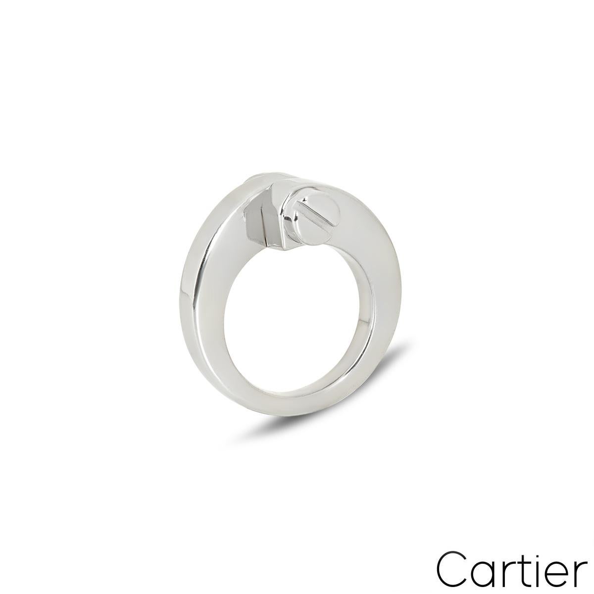 A trendy 18k white gold Cartier ring from the Menotte collection. The ring features two screw motif terminations at the centre. The ring tapers down from 11mm to 3mm, is a UK size I, US size 4.25/ EU size 47 and has a gross weight of 13.75
