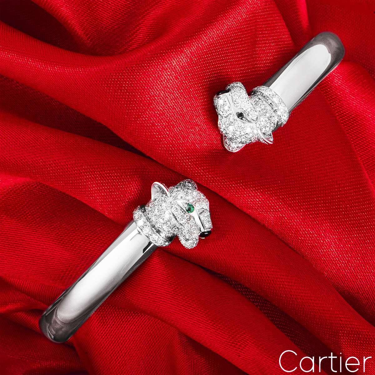 An 18k white gold cuff bracelet by Cartier, from the Panthère de Cartier collection. The piece comprises of two panther heads opposite each other, pave set with 194 round brilliant cut diamonds with a total weight of 1.37ct. Further complementing