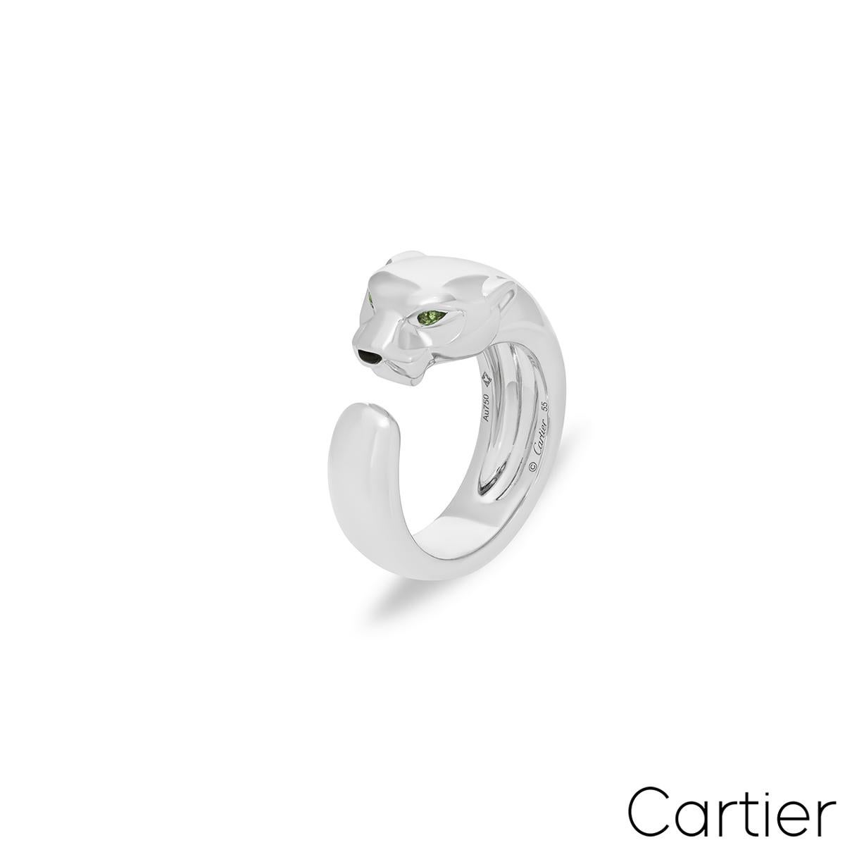 A striking 18k white gold ring by Cartier from the Panthere de Cartier collection. The ring features a panther motif that curls around the finger with 2 pear cut tsavorites as eyes and an onyx nose. The ring measures 11mm wide, is a UK size O/ US