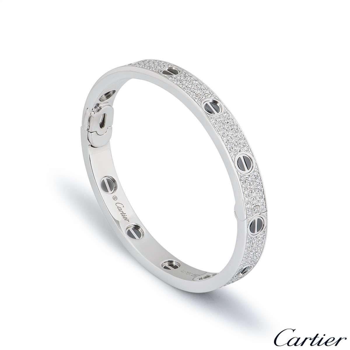 A stunning 18k white gold diamond and ceramic bracelet by Cartier from the Love collection. The bracelet has black ceramic on the iconic screw motif around the outer edge with 204 round brilliant cut diamonds pave set between the screws. The total