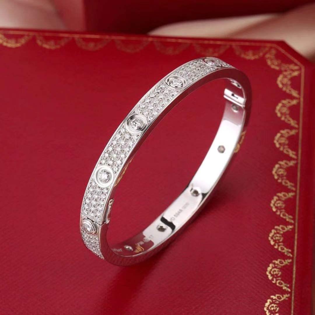18K white gold, set with 216 brilliant-cut diamonds totalling 3.15 carats.With a jaw-dropping Vvs1 Clarity E-F Color Diamonds gracing the entirety of its length, this 18k white gold Cartier Love Bracelet is captivating to a degree that almost defies