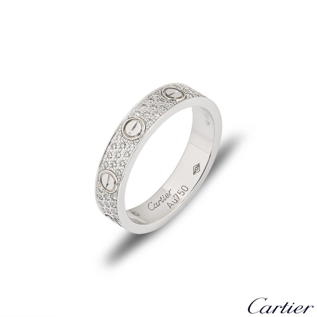 An 18k white gold Cartier diamond pave ring from the Love collection. The ring comprises of the iconic screw motifs displayed around the outer edges with 88 round brilliant cut diamonds totalling 0.31ct set between each screw motif. The ring