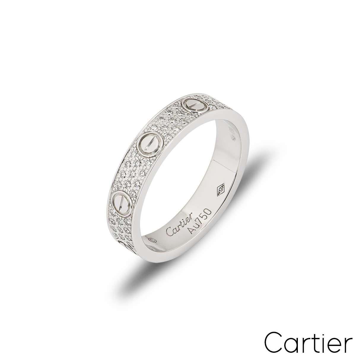 An 18k white gold Cartier diamond pave ring from the Love collection. The ring comprises of the iconic Cartier screws motifs and 88 round brilliant cut diamonds totalling 0.31ct set between each screw. Measuring 5mm in width and a size UK N½ - EU
