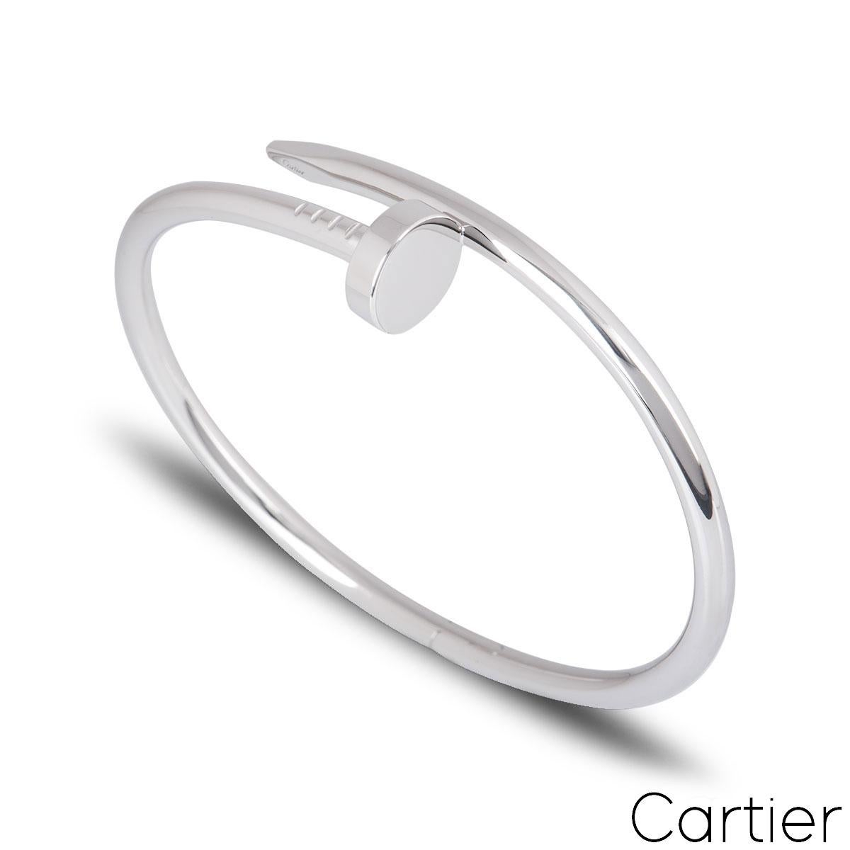 An exquisite 18k white gold Cartier bracelet from the Juste Un Clou collection. The bracelet is wrapped around with a nail head at one end and nail end at the other tip. The bracelet is size 15 with the new style clasp fitting and has a gross weight