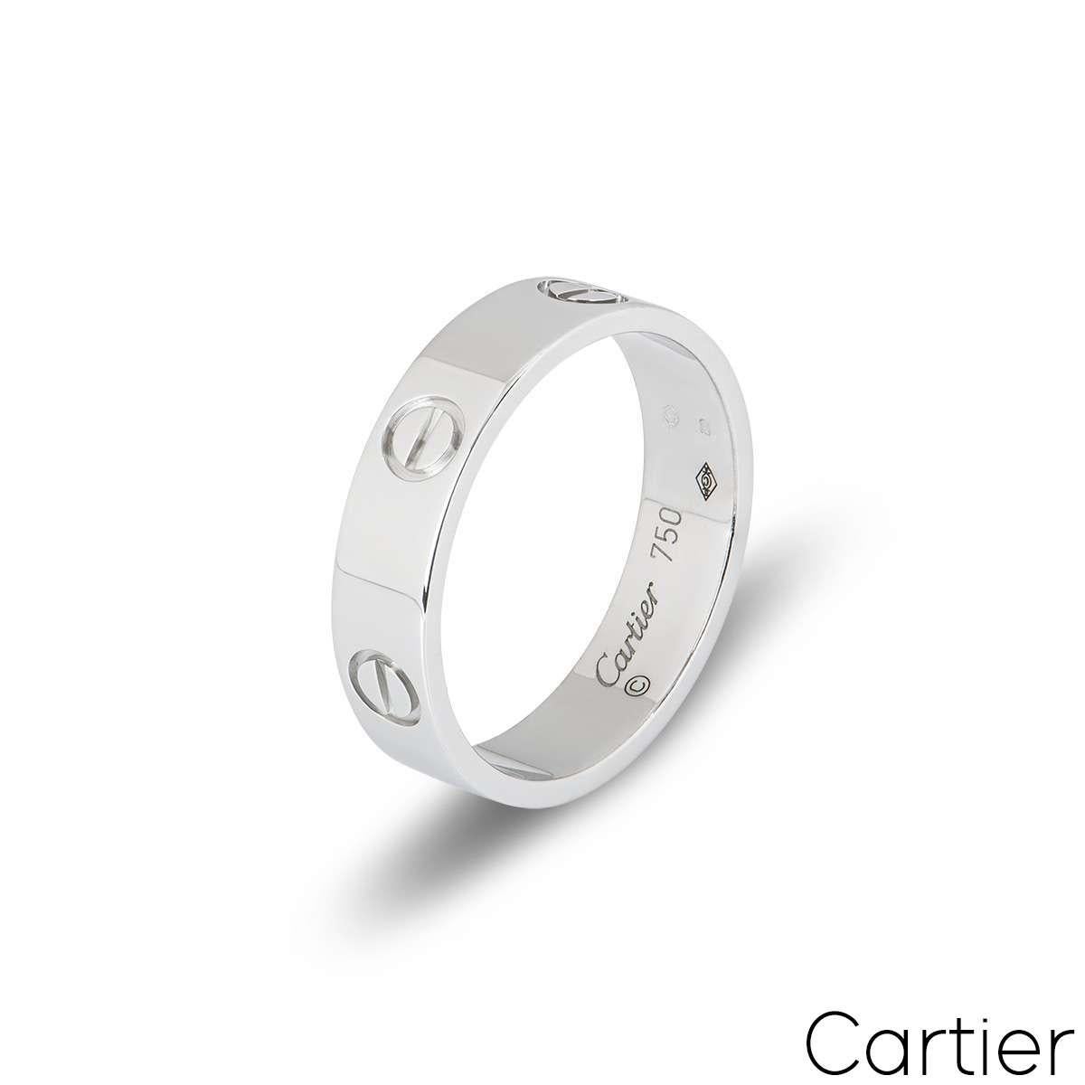 A signature Cartier ring in 18k white gold from the Love collection. The ring comprises of the iconic screw motifs on the outer edge. Measuring 5.5mm in width and a size UK N - EU 53, this ring has a gross weight of 6.79 grams.

Comes complete with