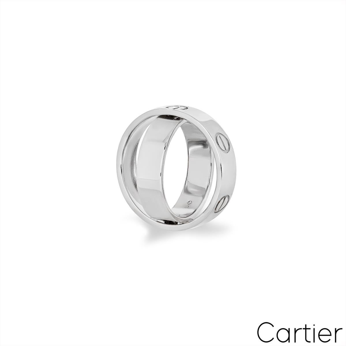 A unique 18k white gold Spicy Love ring by Cartier. The ring comprises of two rings that pivot on hinges that open up and can be also worn as a pendant. The outer band displays 6 iconic screw motifs around the outside of the ring and the inner band