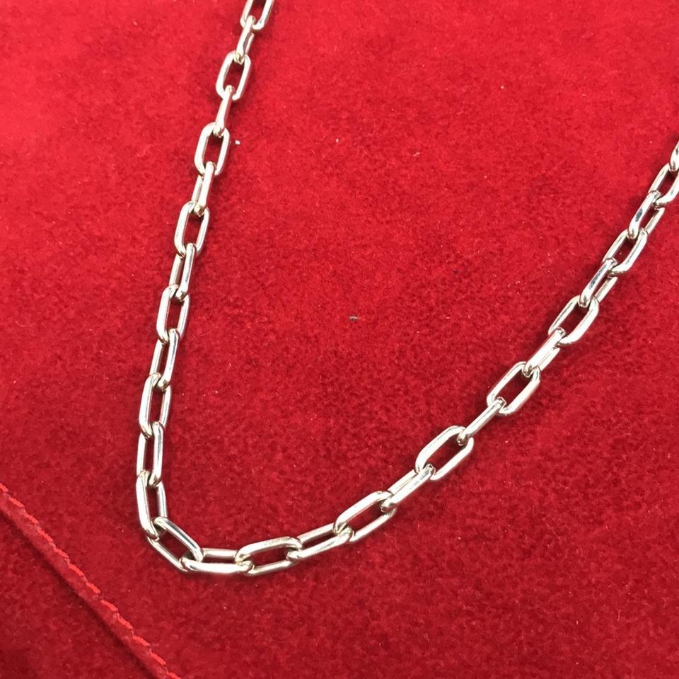 Material: 18k white gold
Hallmark: Cartier 750 Serial
Measurements: 17 inches
Weight: 33.5 grams

Comes with Cartier pouch.
Will buff it up before shipping so it looks brand new.

This is a bold and beautiful authentic necklace by Cartier from their