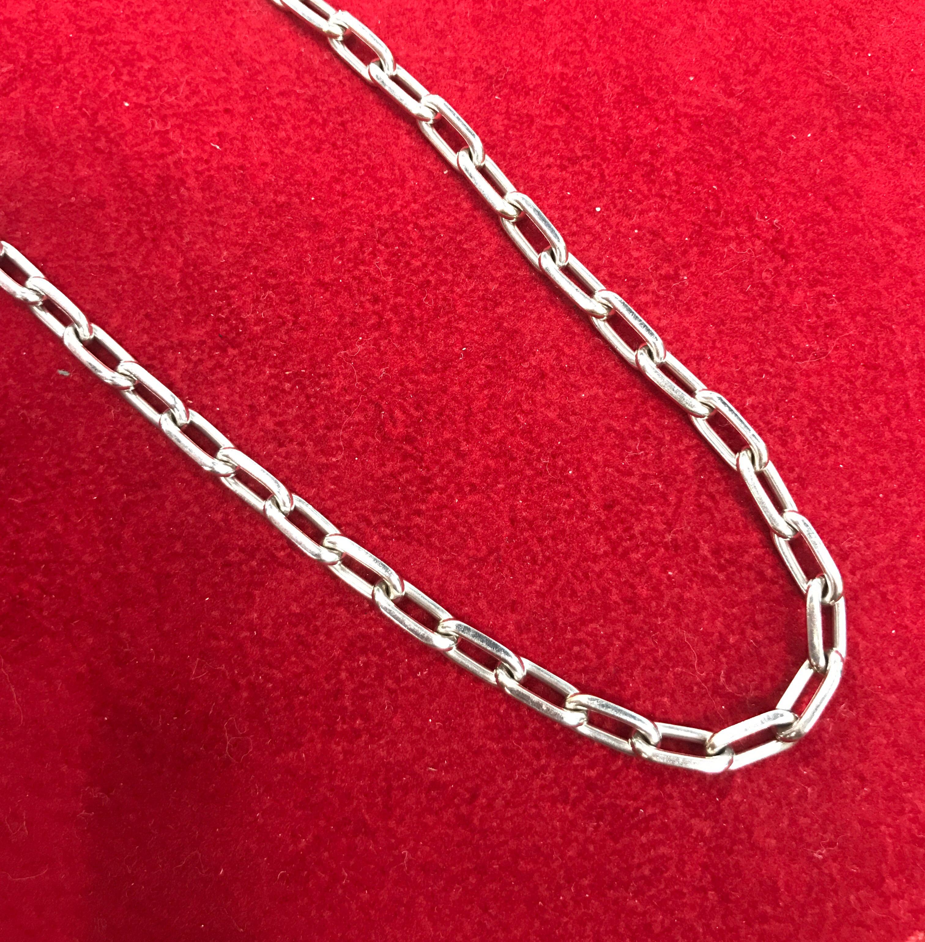 Material: 18k white gold 
Hallmark: Cartier 750 Serial
Measurements: 17 inches 
Weight: 33.5 grams

Comes with Cartier pouch.
Will buff it up before shipping so it looks brand new. 

This is a bold and beautiful authentic necklace by Cartier from