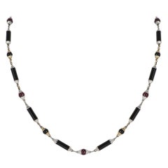 Collier Le Baiser Du Dragon en or blanc et jaune, onyx et rubis de Cartier