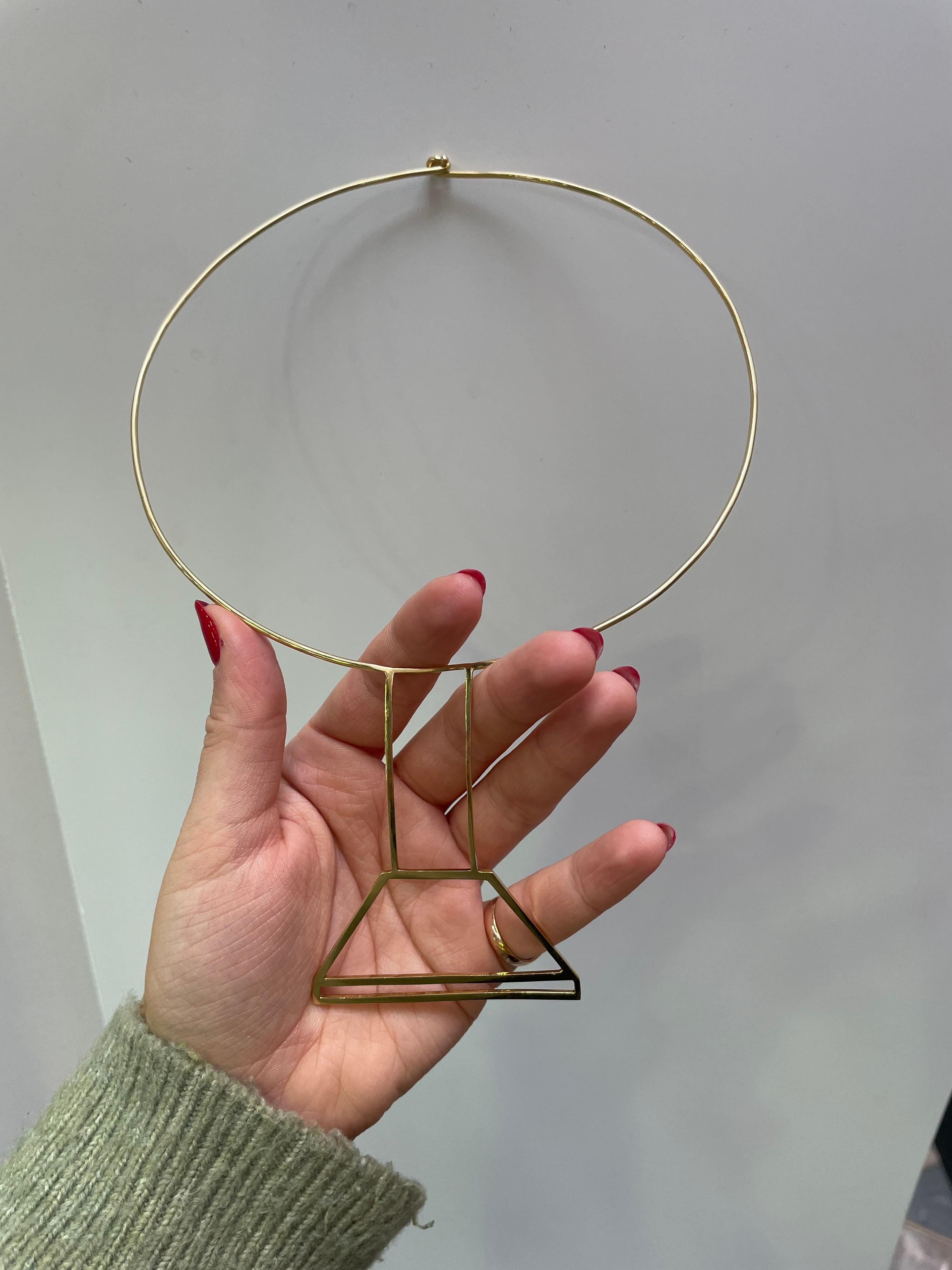 A vintage Cartier wire necklace in 18 karat yellow gold, circa 1970.

Designed in the 1970’s, this necklace has a bold, stripped back minimal chic. Attributed to Jean Dinh Van for Cartier, a jeweller hailing from Paris famous for his non-conformist
