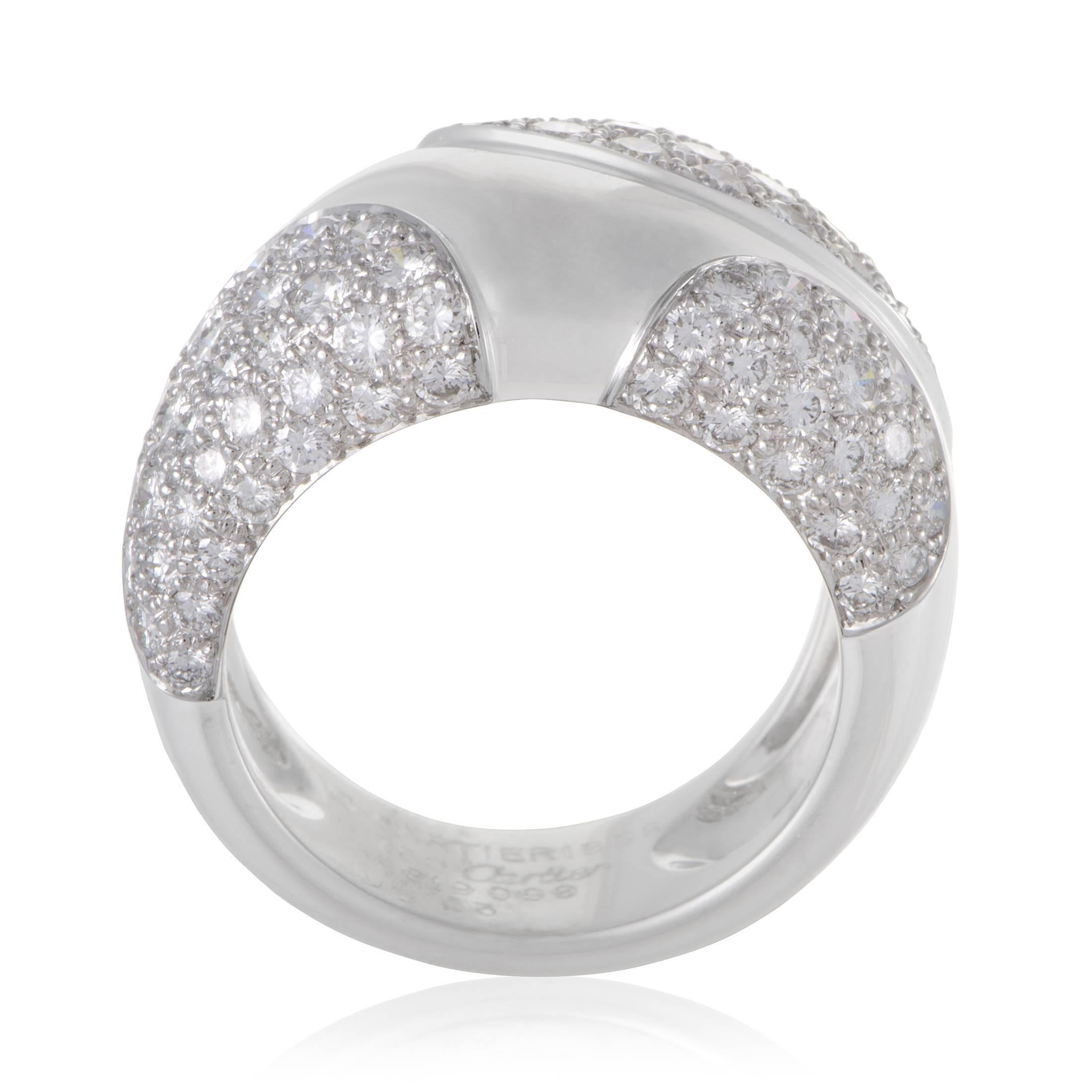 Partially paved with wonderfully lustrous diamonds weighing in total 3.25 carats, this magnificent 18K white gold ring from Cartier exudes exceptional style and fascinating quality with its immaculate polish and exquisite gem-setting. Ring Top