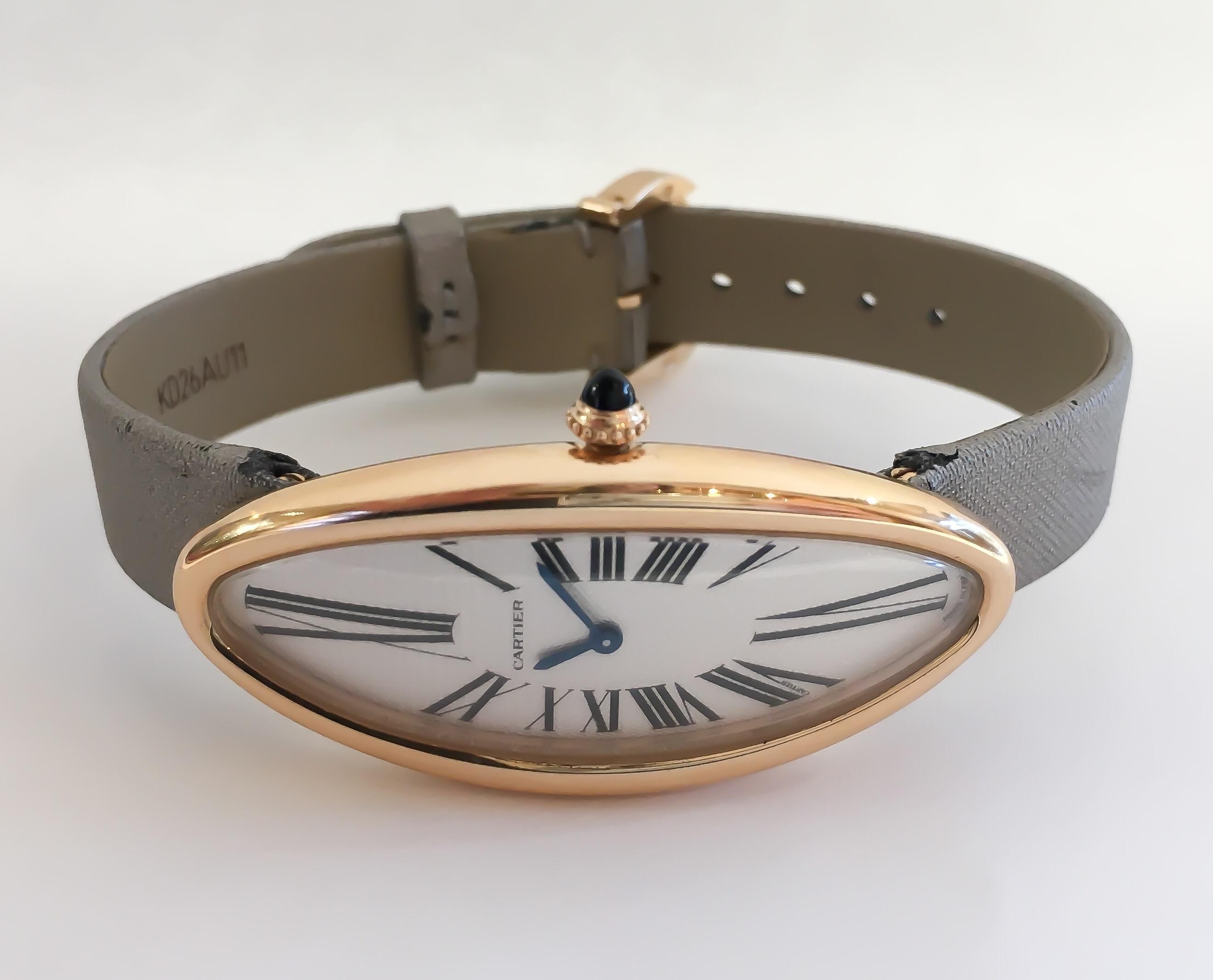 This is a rare Cartier timepiece designed in premium 18 karat rose gold. Baignoire Allongee is a discontinued model, very hard to find. It is in excellent condition with some wear on the satin leather strap. The strap can be ordered/replaced at a