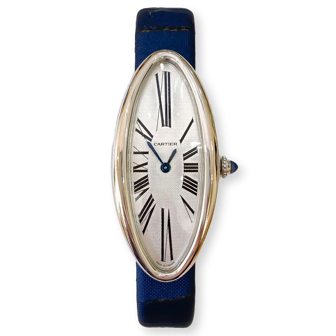 Rare Cartier timepiece designed in solid 18 karat white gold. Baignoire Allongee is a discontinued model, very hard to find. It is in excellent condition with some wear on the satin leather strap. The strap can be ordered/replaced at a Cartier