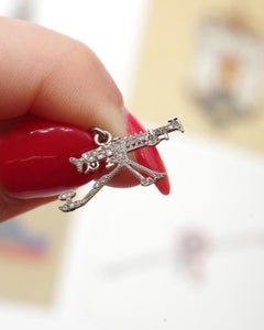 Cartier WWI 1910 patriotic machine gun charm in platinum and diamond