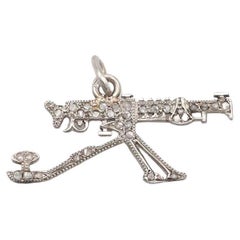 Cartier WWI 1910 patriotic machine gun charm in platinum and diamond
