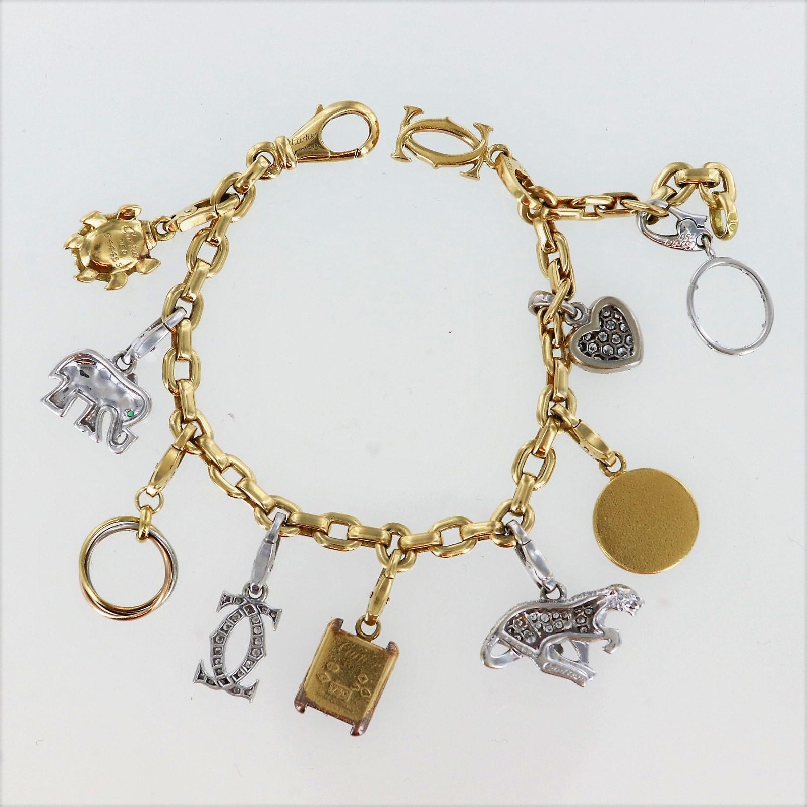 Each charm and bracelet numbered and signed Cartier