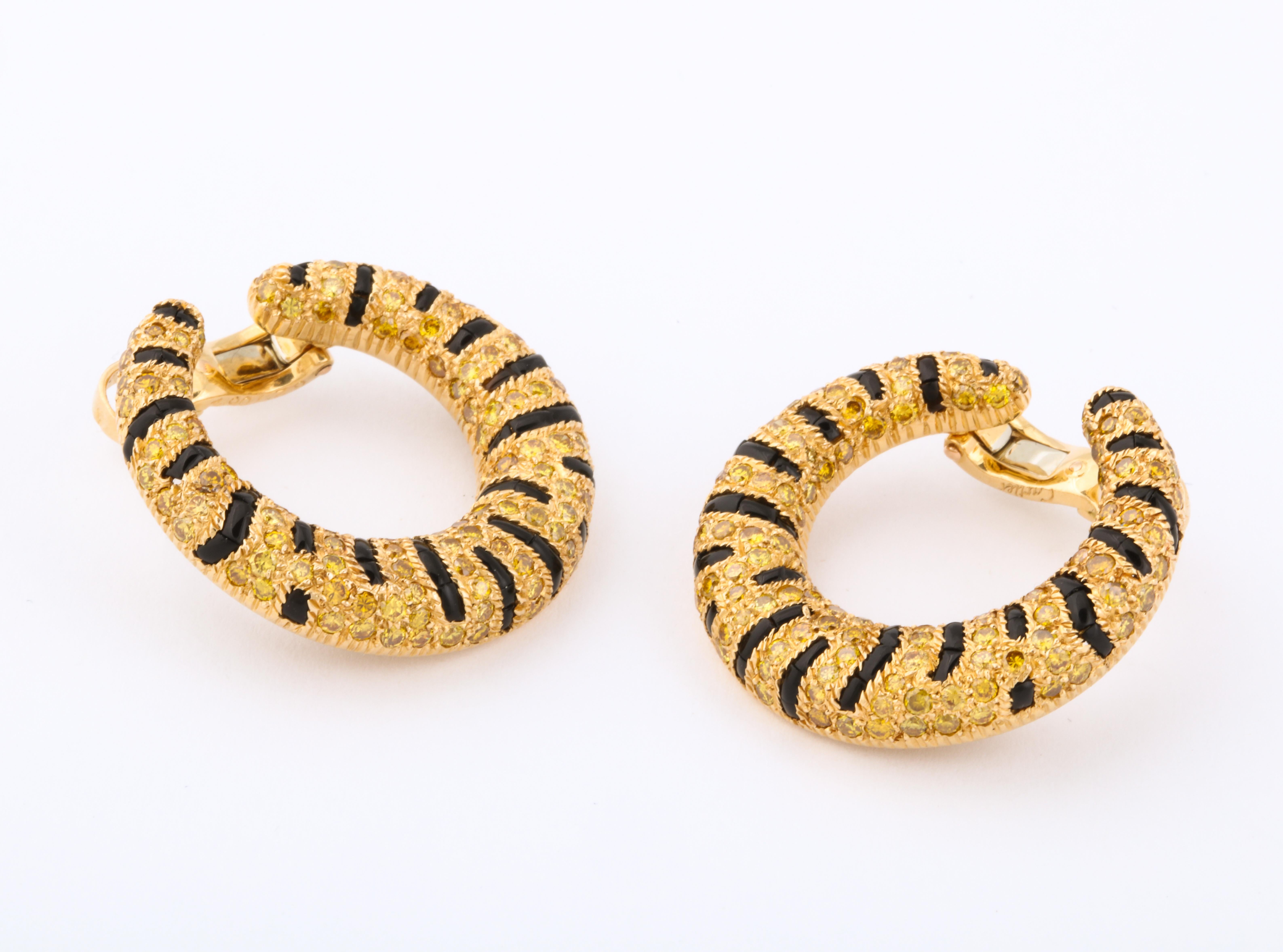Cartier has always been well know for their big cat designs and, in addition to their iconic panther pieces, the tigers are infamous.  Famous examples were in The Duchess of Windsor's collection.  These earclips are the perfect combination of a