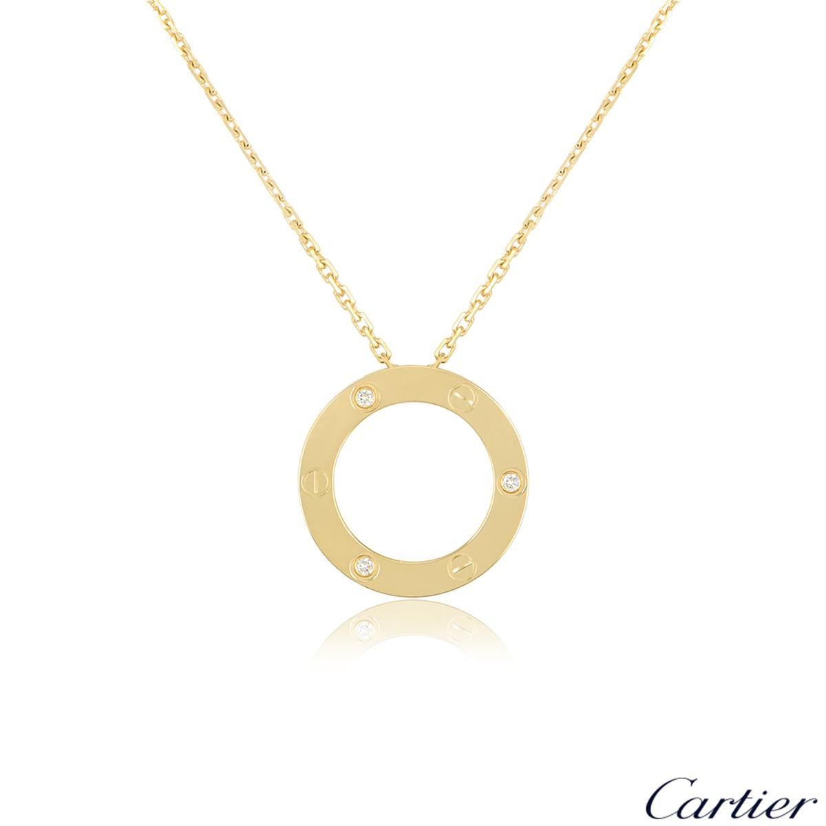 An 18k yellow gold diamond set pendant from the Cartier Love collection. The pendant is composed of an open work circular motif, set to the outer edges with three round brilliant cut diamonds totaling 0.07ct alternating between the iconic screw