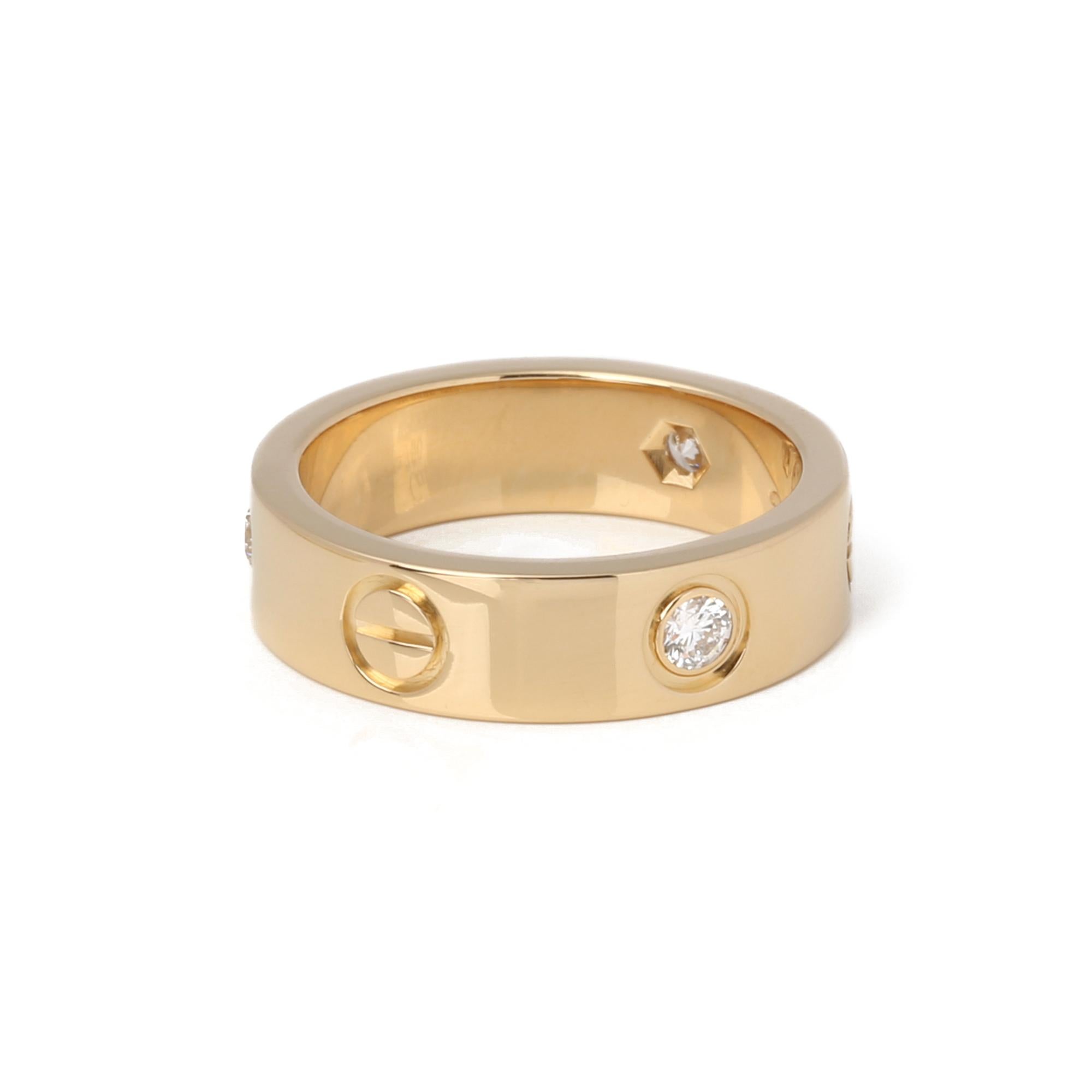 This ring by Cartier is from their signature Love collection and features three round brilliant cut diamonds. UK ring size M. EU ring size 53. US ring size 6 1/2. Mounted in 18 yellow gold. Complete with a Xupes presentation box. Our Xupes reference