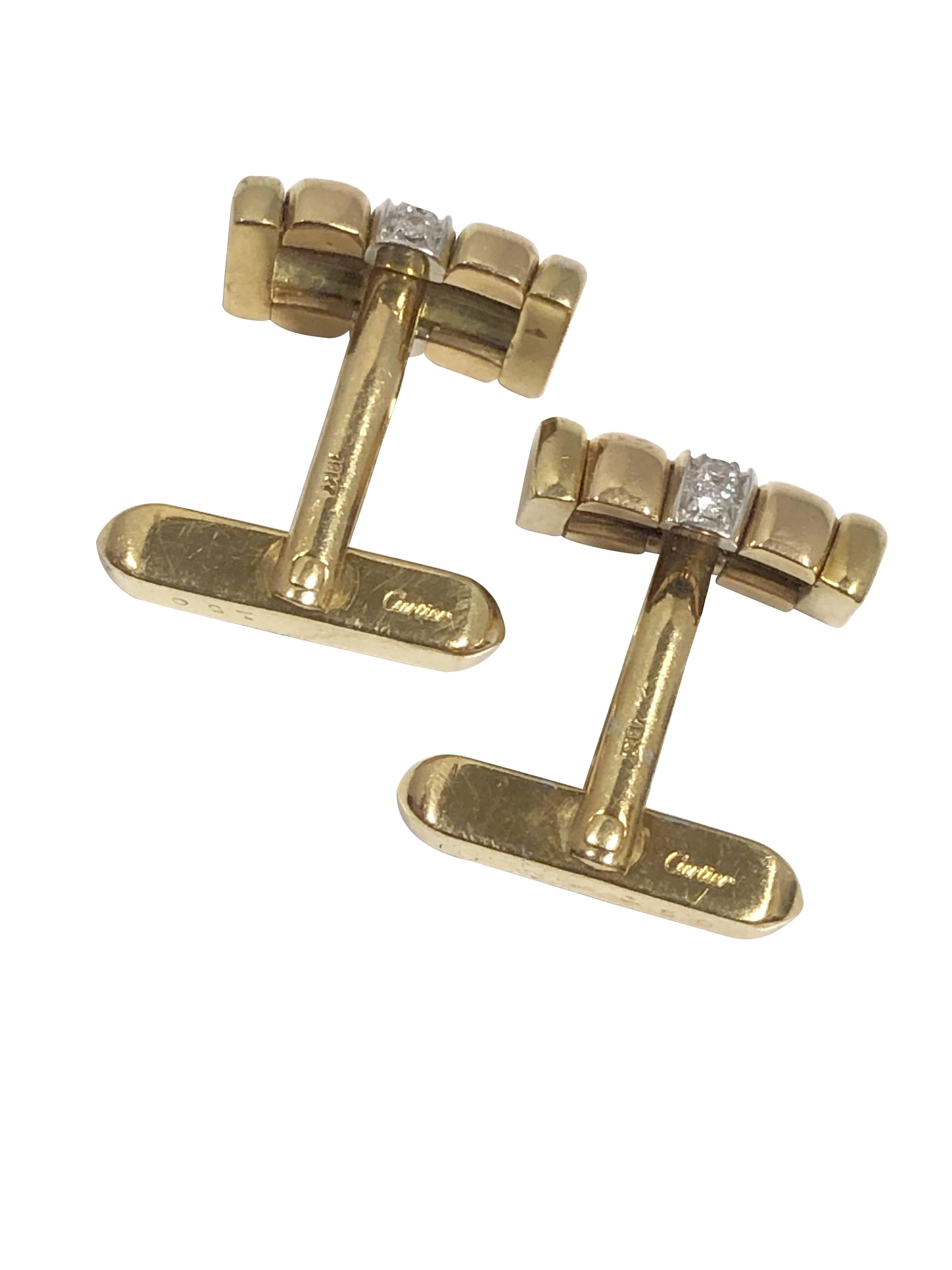 Circa 1990s Cartier 18k Yellow Gold Cufflinks, the tops measure 5/8 inch in length and 1/4 inch wide, nice solid construction with a weight of 14 Grams, the White Gold center section is set with Round Brilliant cut Diamonds totaling 1/4 Carat.