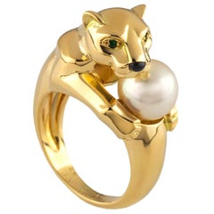 Bague Panthère en or jaune et perle de Cartier avec yeux d'émeraude