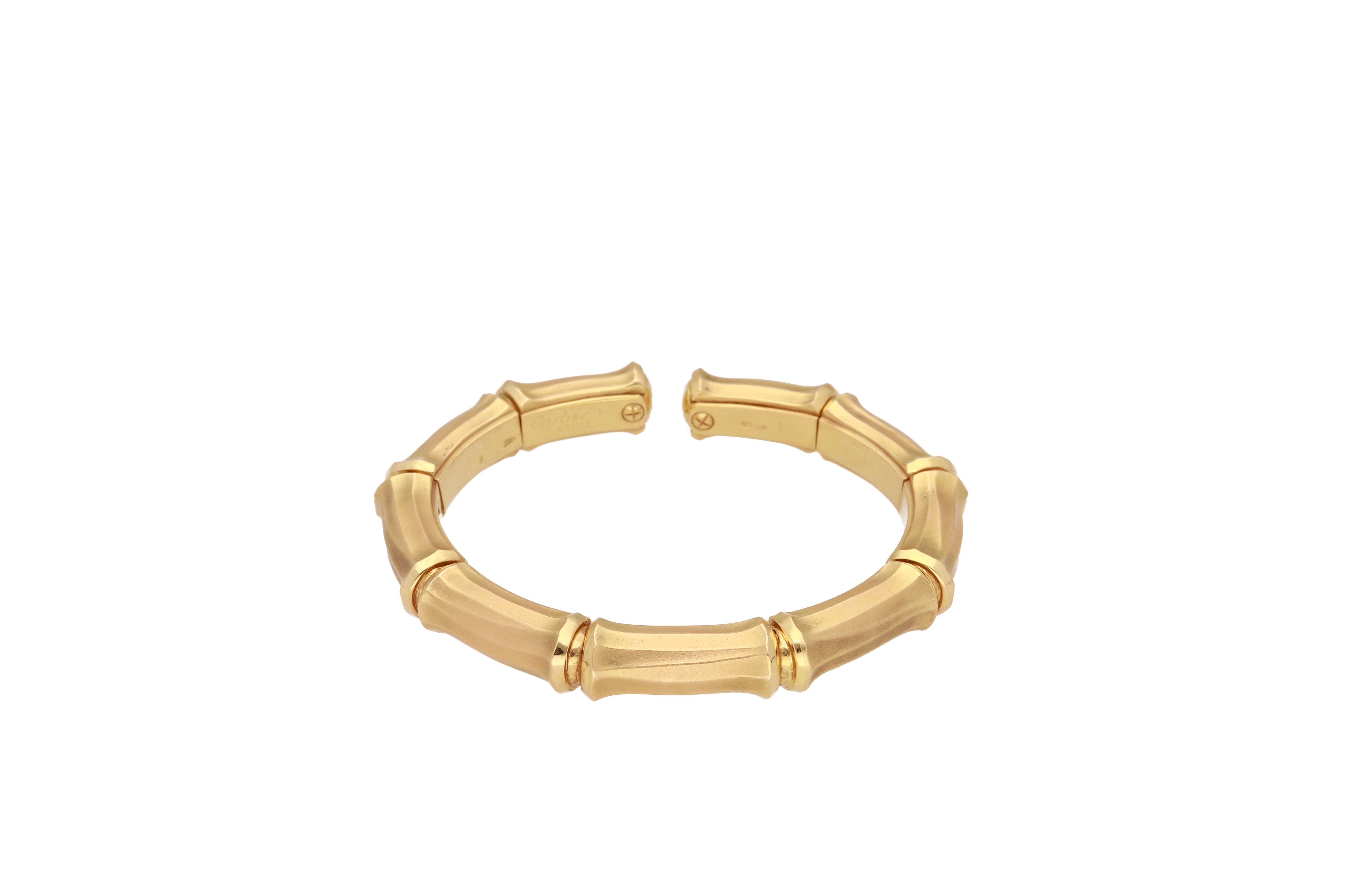18 kt. yellow gold cuff bangle bracelet signed Cartier.
This classic cuff bangle is from 1980, formed by nine sections.
Is flexible and it can fit different sizes.
Signed and numbered.