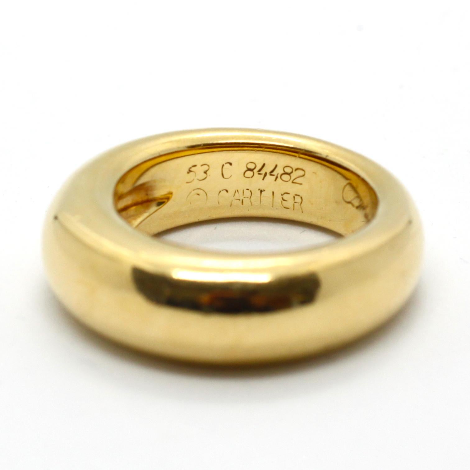 A yellow gold band ring by Cartier. The ring is in massive 18k yellow gold but still looks very sleek, which is very comfortable on the finger. The ring size is 53. The ring is signed and numbered by Cartier and has makers marks.