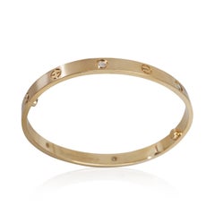 Bracciale Love Cartier in oro giallo con diamanti e finitura spazzolata