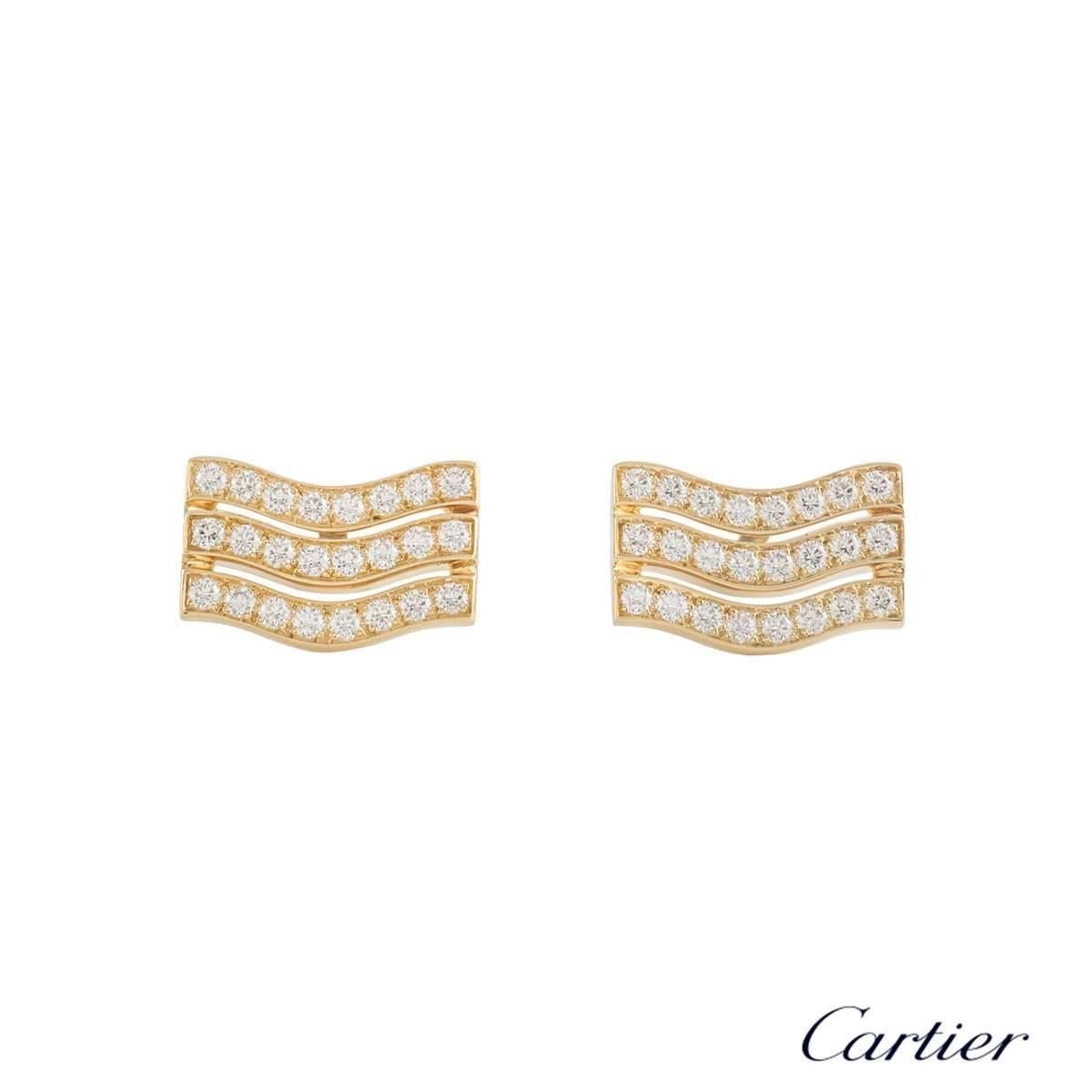 A pair of 18k yellow gold diamond Cartier cufflinks. The cufflinks each comprise of 3 rows in a wave motif with round brilliant cut diamonds in each. There are 48 diamonds with a total weight of approximately 1.44ct, G+ colour and VS+ clarity. The