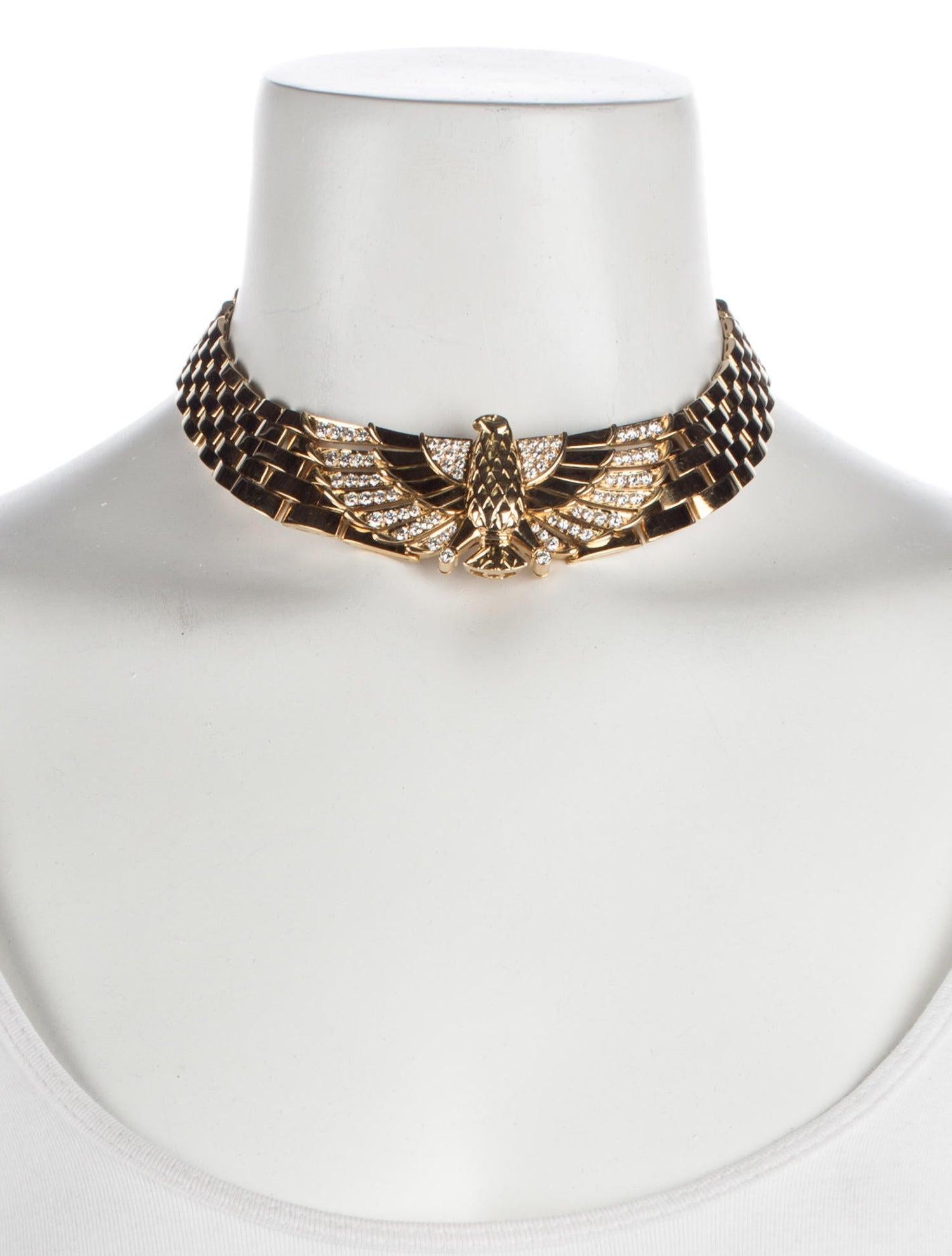 Questions? Call us anytime!
The Back Vault NYC.
833,998,2858

Simply stunning!

The flexible, polished brick-link collar, set to the front with a chased falcon motif and pave-set brilliant-cut diamond detail, with concealed clasp.

Decorated with