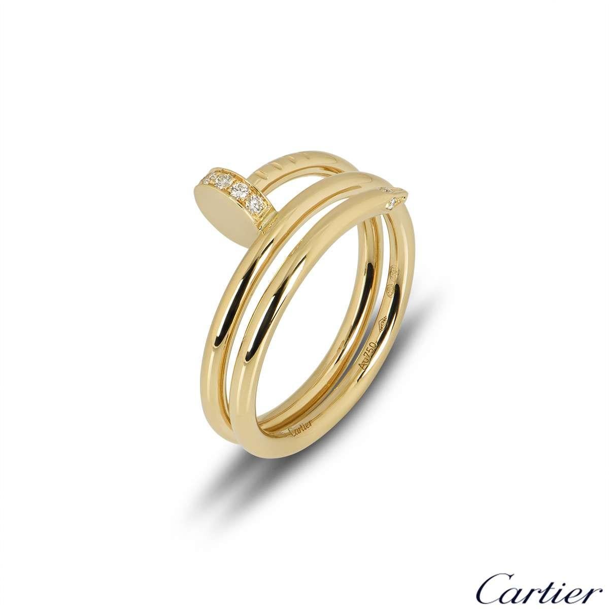 An 18k yellow gold double Juste Un Clou ring by Cartier. The ring is in the style of a nail wrapping around the finger, set with 14 round brilliant cut diamonds with a total weight of 0.08ct. The ring measures 1cm at the widest point and is a size