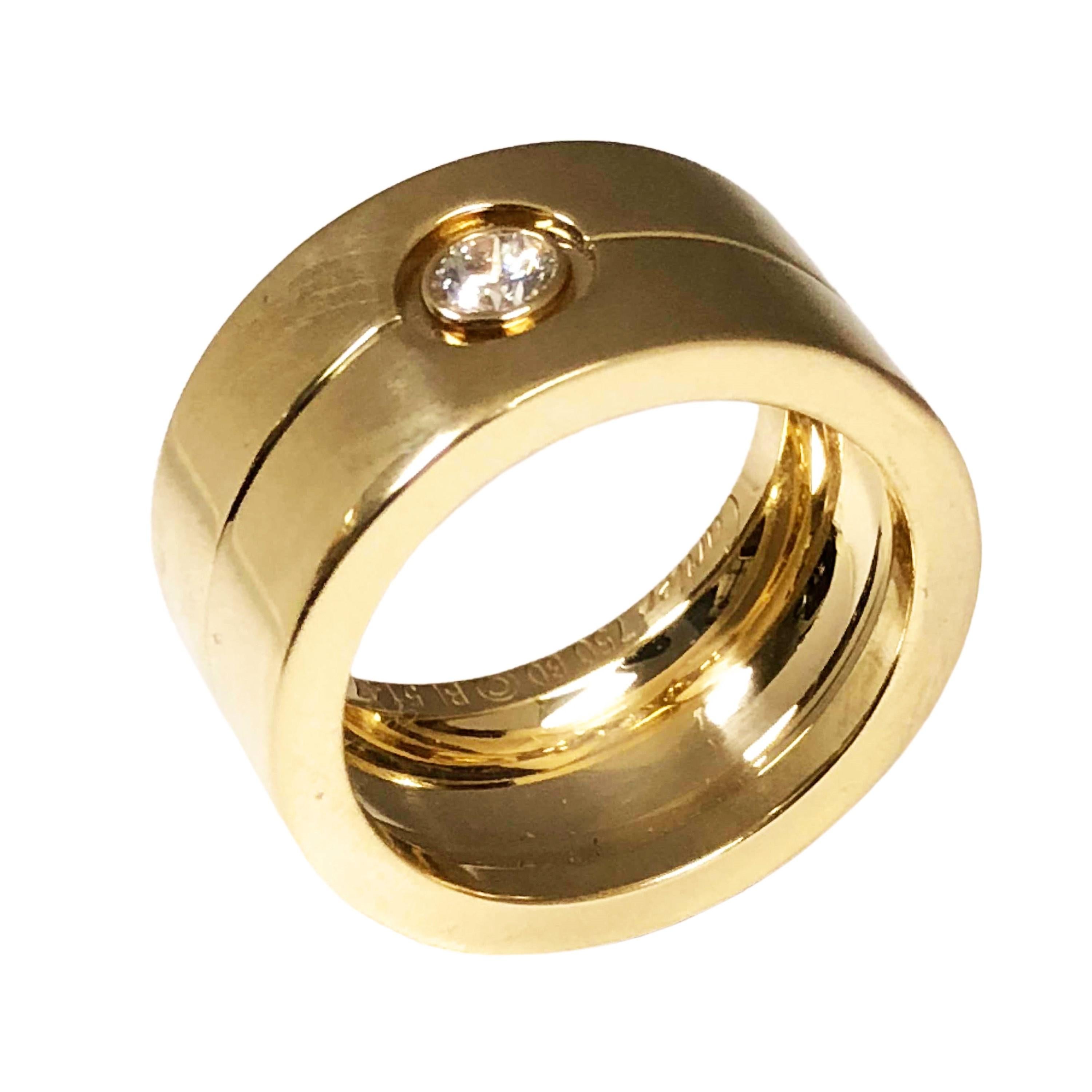 Circa 2010 Cartier 18K Yellow Gold Wide Love Band Ring, this ring is from a very limited collection and are hard to find. Measuring 1/2 inch wide and 2 MM thick, centrally set with a 1/4 carat Round brilliant cut Diamond. Finger size 9 ( 60 European