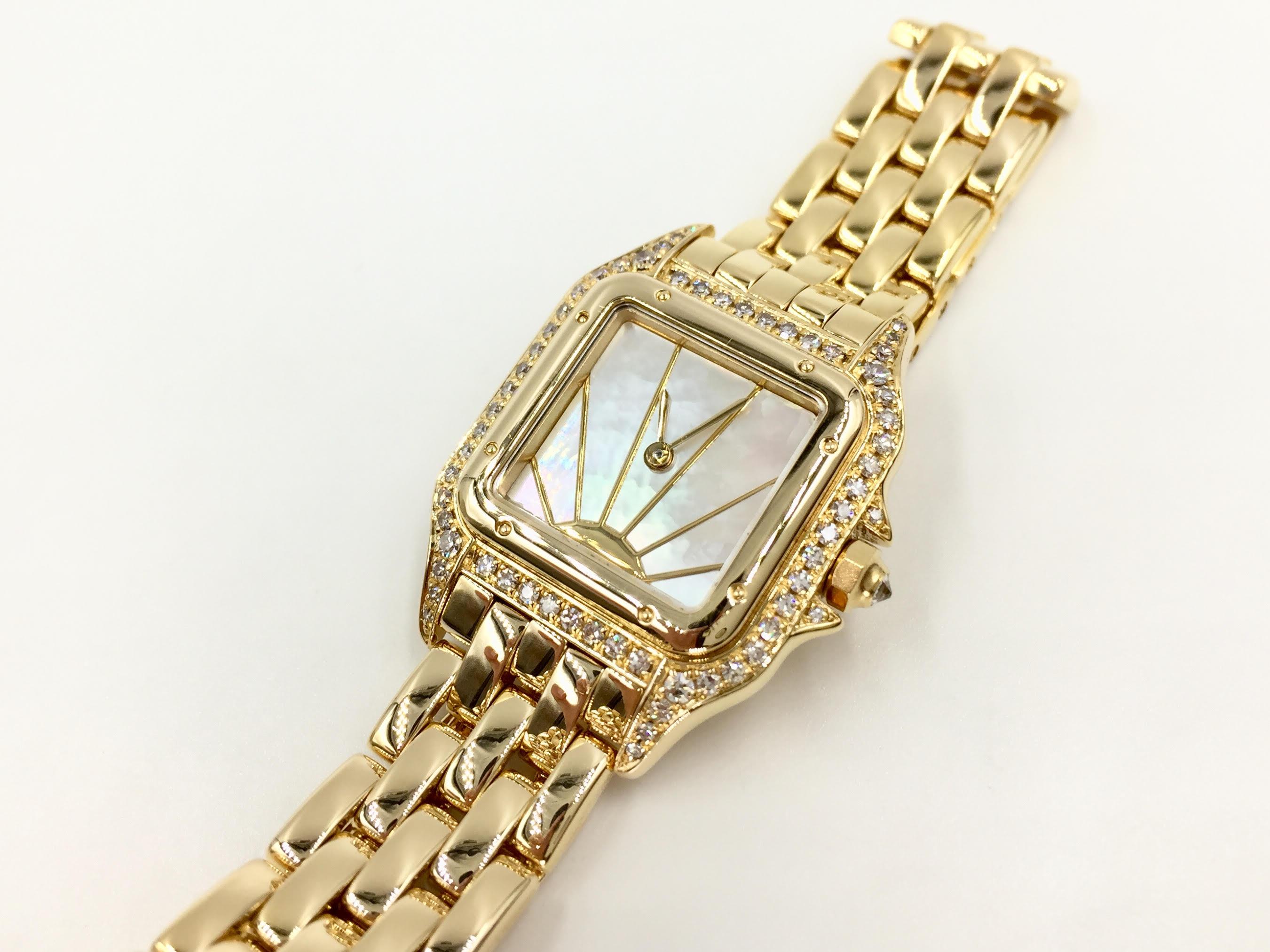 Timeless authentic Panthére De Cartier solid 18k gold watch with rare mother of pearl sunburst dial. Cartier factory diamond bezel. Width of watch is 22mm. Width of bracelet is 12mm. Double deployment clasp. Quartz movement. Battery replaced in
