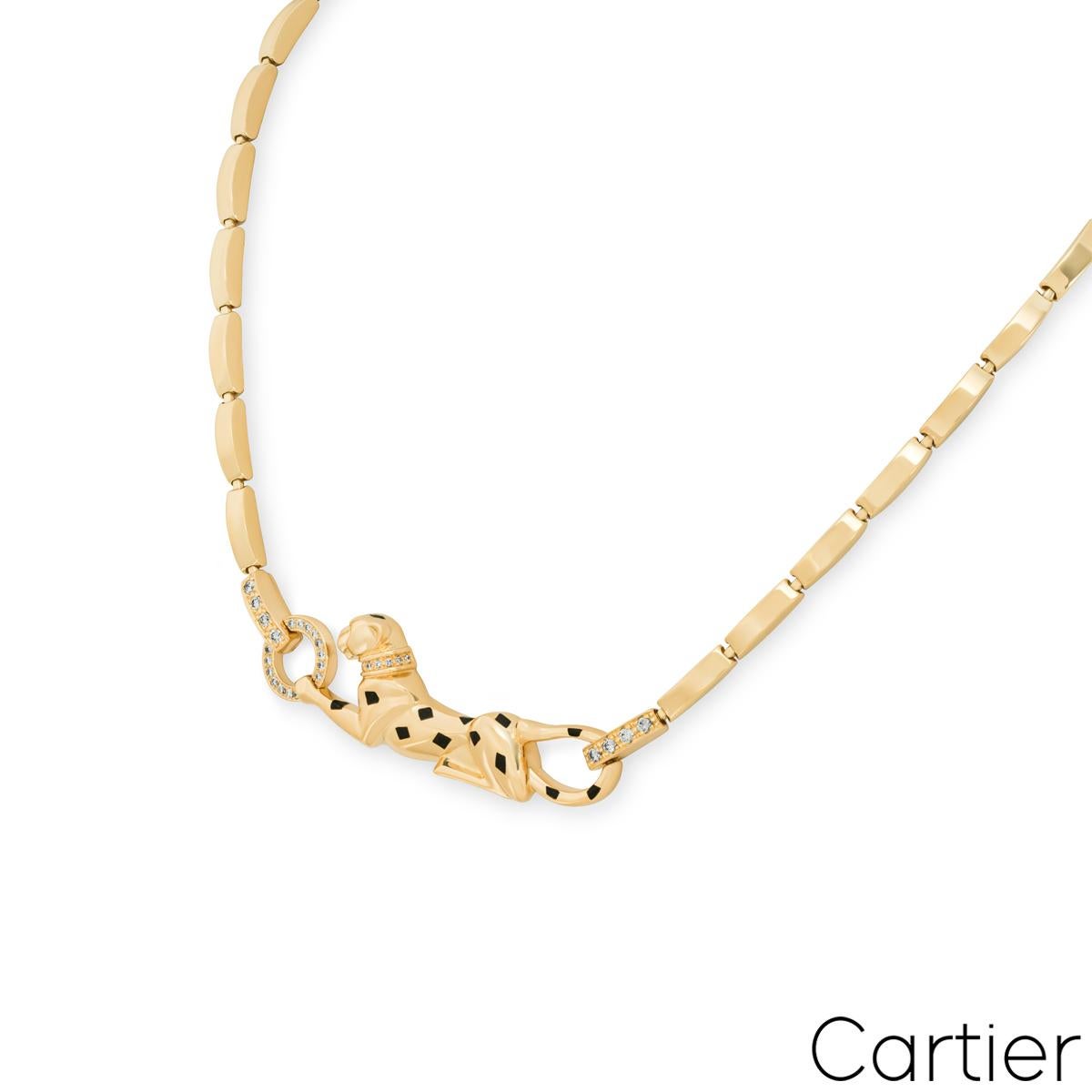 A striking Cartier 18k yellow gold diamond necklace from the Panthère De Cartier collection. The necklace features a panther motif with bold black lacquer spots, a round brilliant cut tsavorite eye, an onyx nose and is further complemented by 32