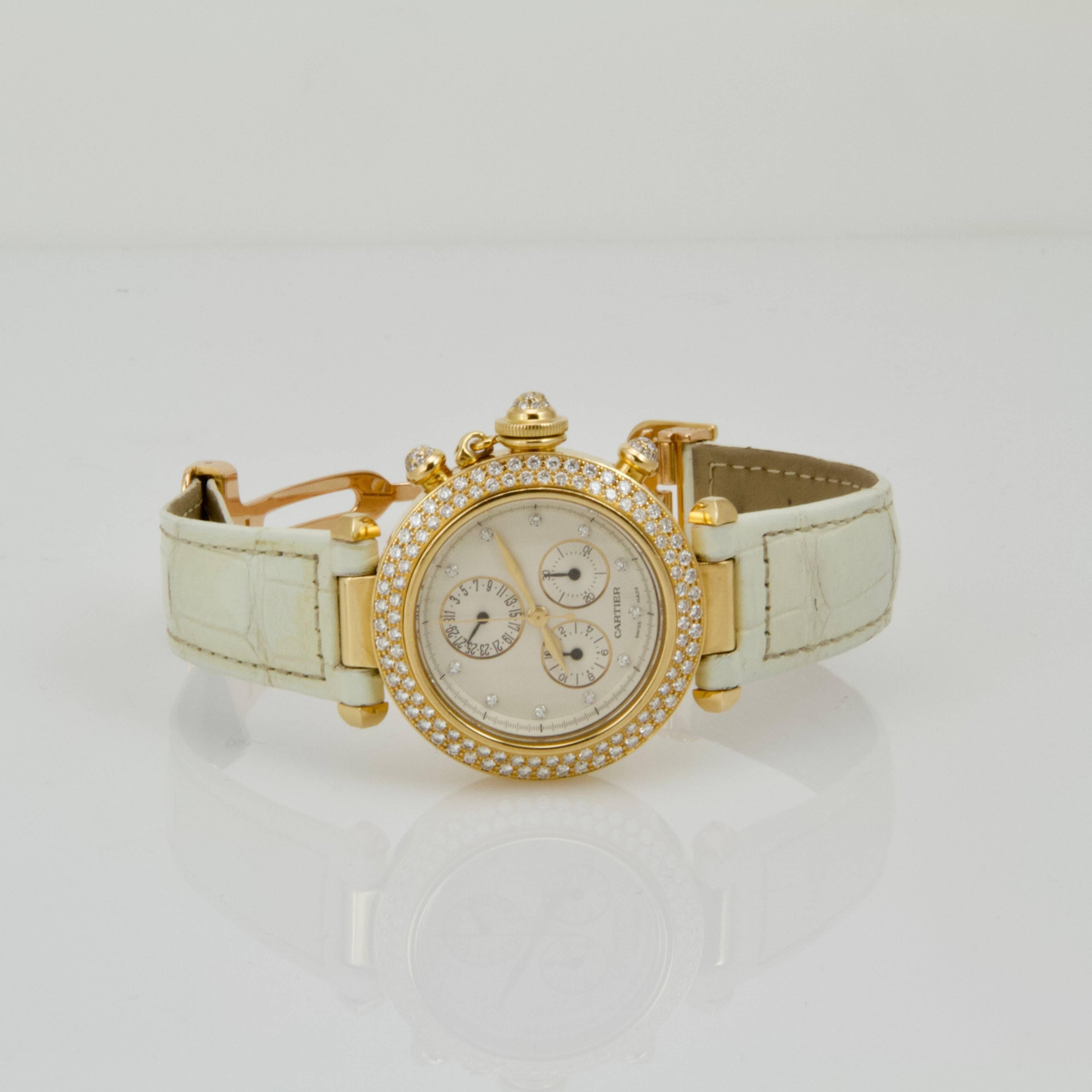 18-karat yellow gold diamond Pasha wristwatch by Cartier. 
Brand: Cartier
Style name: Pasha
Reference number: 1354/1
Case material: 18-karat yellow gold with diamonds
Dial color: White dial, gold hands
Movement: Quartz
Functions: Hours,