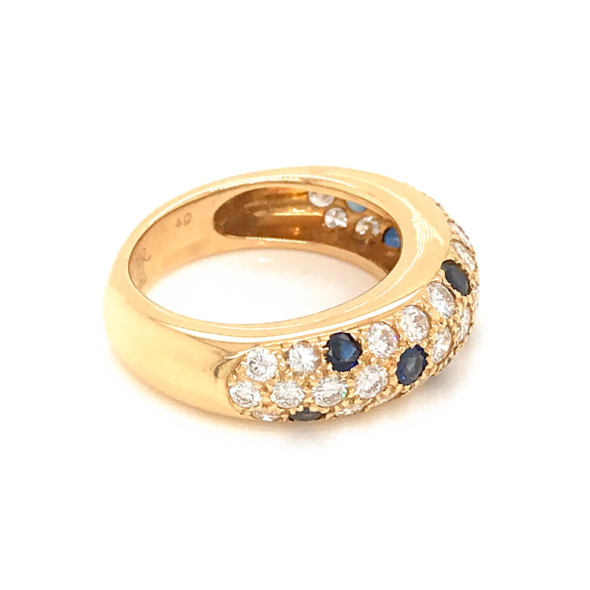 Featuring the ever-enchanting combination of charming 18K yellow gold and lovely appeal of splendid white diamonds and feminine blue sapphires, this spectacular ring from renowned Cartier boasts exceptional design, offering dazzling feminine